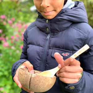 girl eating with ecojiko bamboo spoon